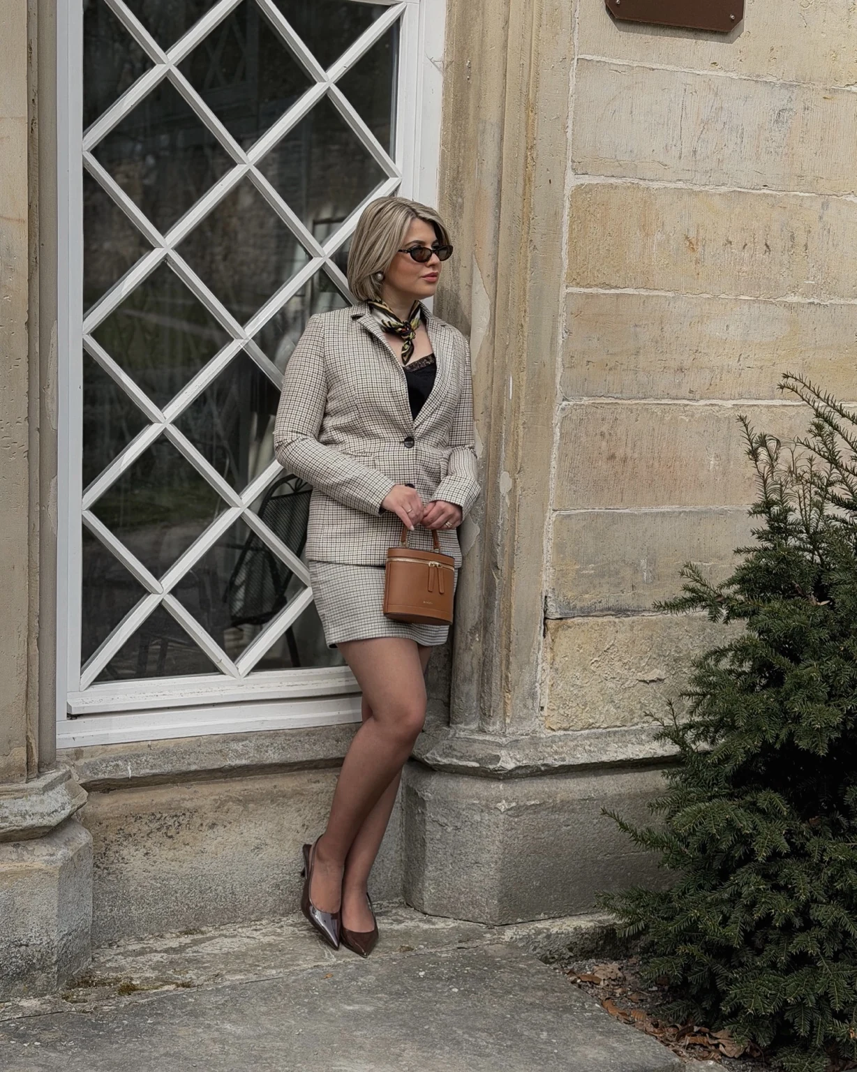Lara wearing a light coat