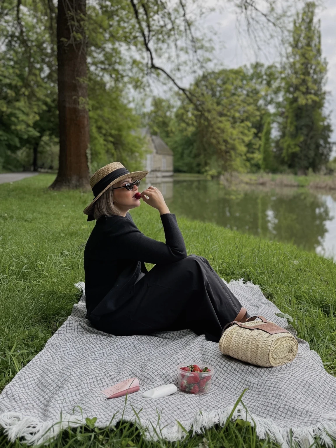 Lara enjoying a picnic by the water